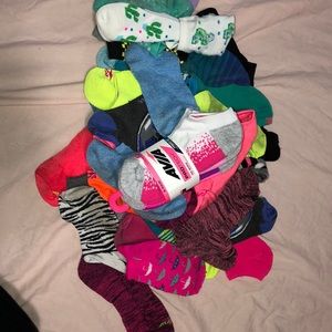 About 50 ankle socks, (not paired)
